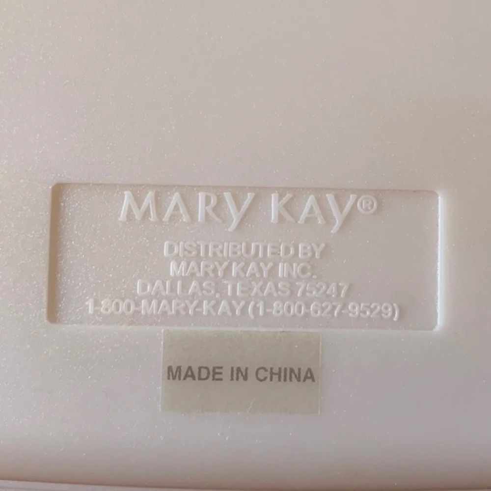 Mary Kay pink plastic compact travel mirror.